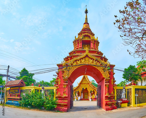 The ornate gate of Wat Sangkharam Temple (Pratu Lee), Lamphun, Thailand photo