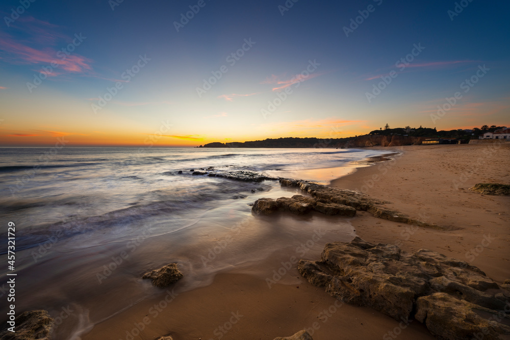 Scenic view of the Vau Beach (Praia do Vau) at sunset, in Portimao, Algarve, Portugal; Concept for summer beach vacations and travel in Portugal