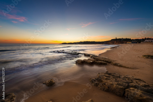 Scenic view of the Vau Beach (Praia do Vau) at sunset, in Portimao, Algarve, Portugal; Concept for summer beach vacations and travel in Portugal photo