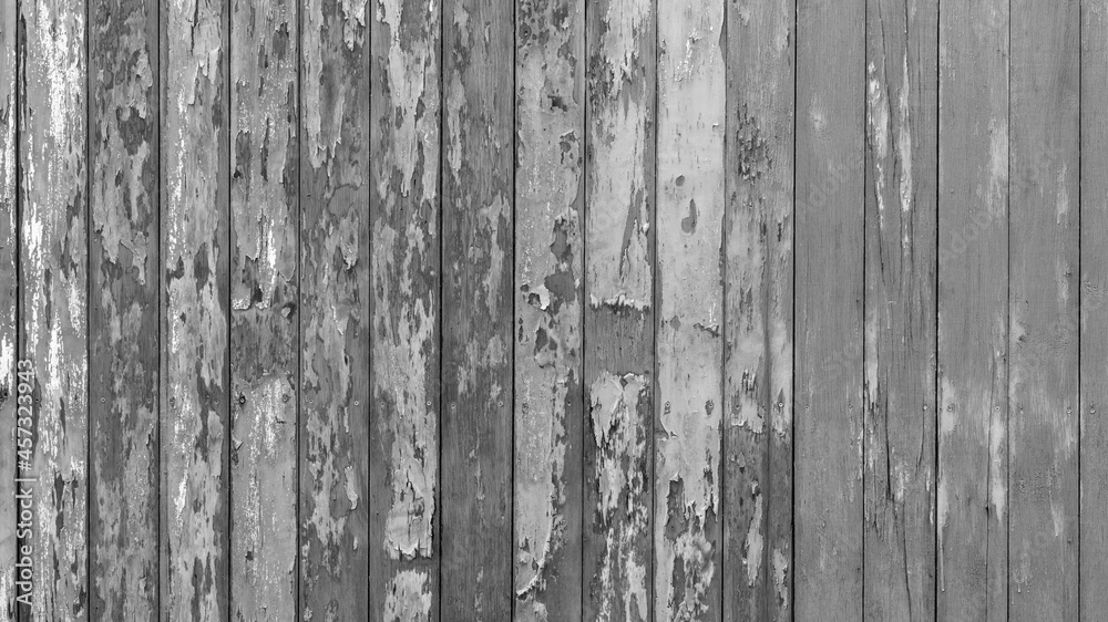 Rusty old wooden plank fence wall background in classic old black and white gray tones of a house in rural Thailand. Rusty old wooden plank fence wall background in classic old black and white gray tones of a house in rural Thailand.