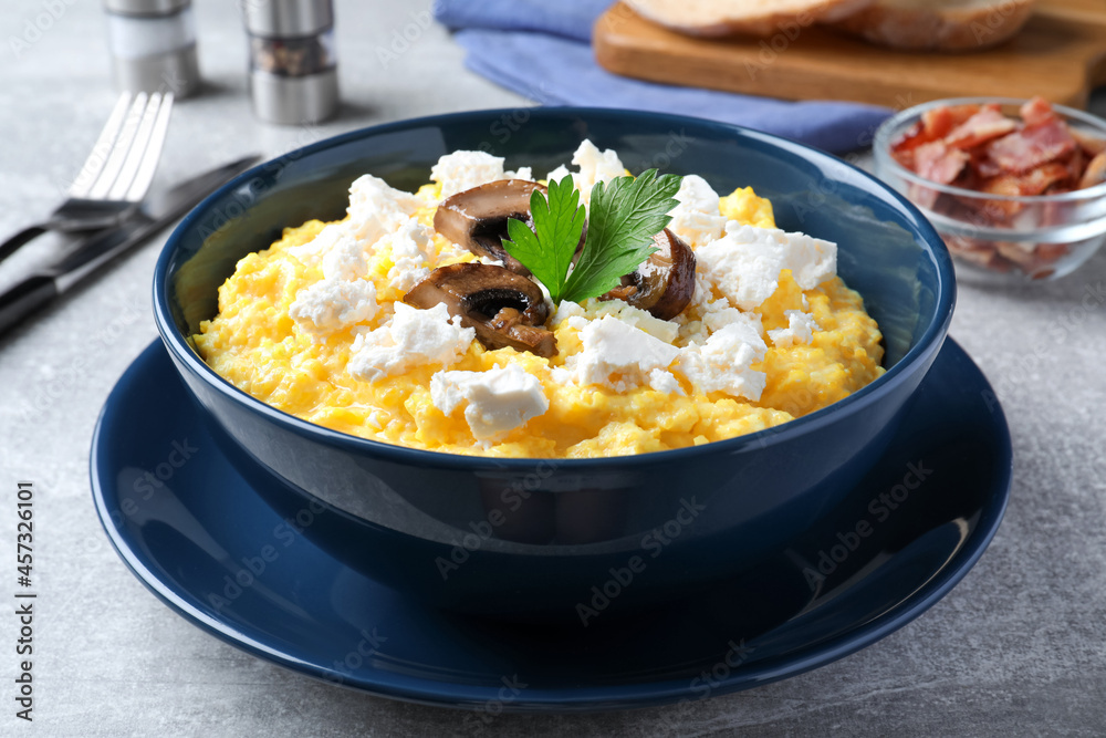 Tasty banosh served with brynza and mushrooms on grey table, closeup. Traditional Ukrainian dish Tasty banosh served with brynza and mushrooms on grey table, closeup. Traditional Ukrainian dish