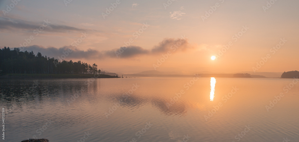 Fototapeta premium peaceful sunrise over lake