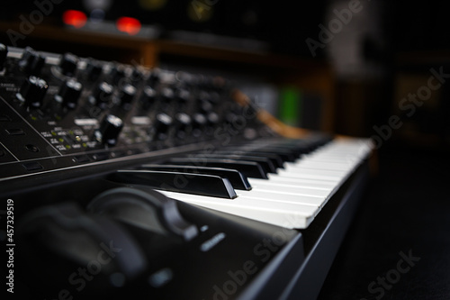 Buy new professional synthesizer piano in dj store to produce modern electronic music tracks in studio