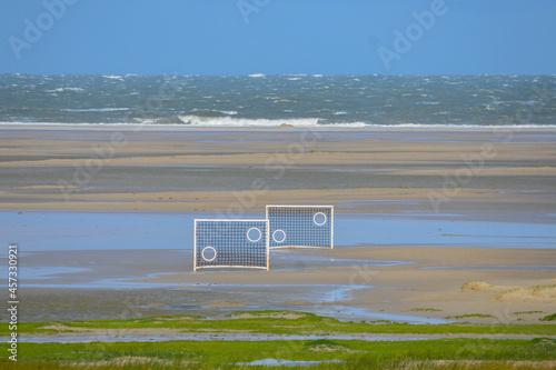 Football goals on the beach photo