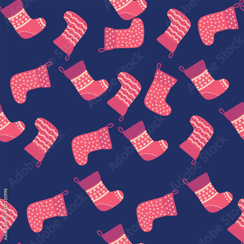 Christmas seamless pattern with red Christmas socks with snowflakes, specks