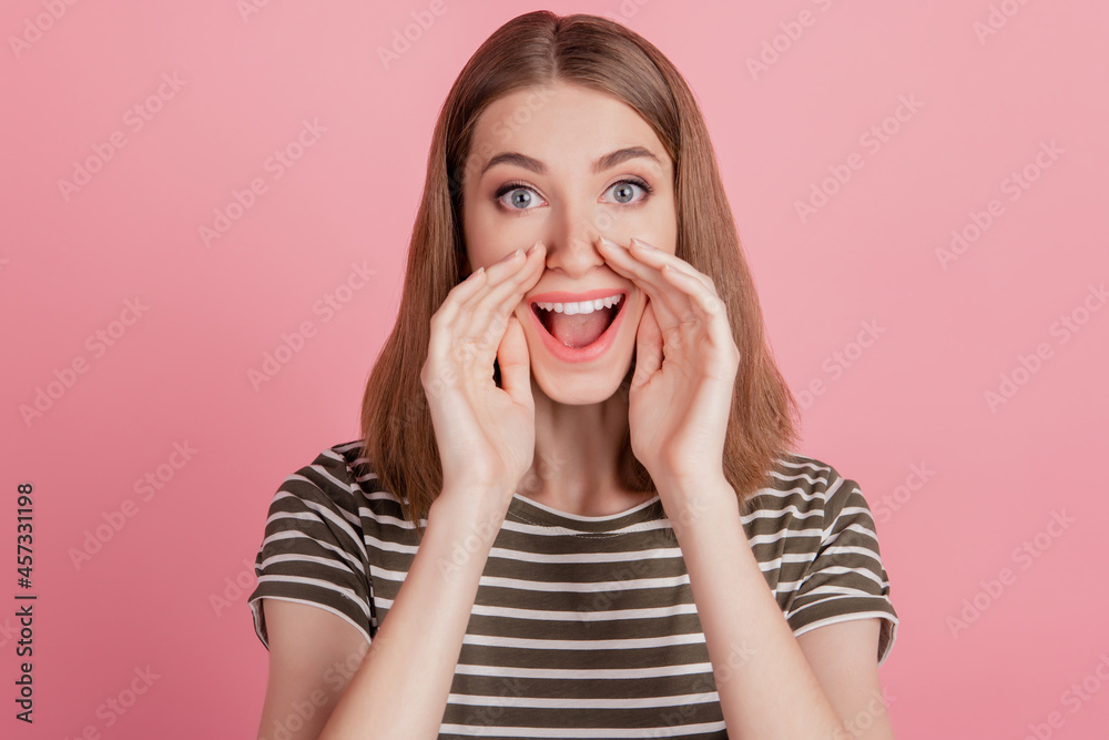Portrait of funny excited promoter lady hands open mouth tell message information on pink background Portrait of funny excited promoter lady hands open mouth tell message information on pink background