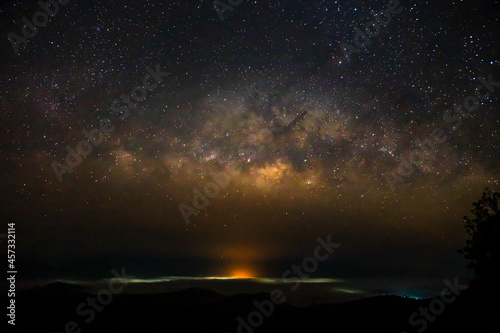 Milky Way Galaxy and fog over Kong city ,Chiang mai, Thailand