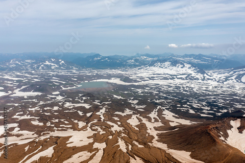 Gorely Volcano crater lake with Mutnovsky Volcano on the background. Kamchatka, Russia photo