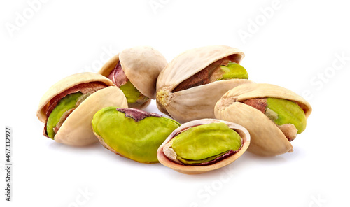 Pistachio nuts in closeup isolated on white background.