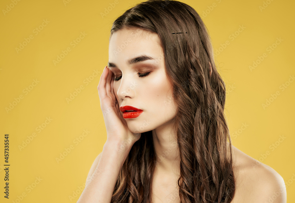 woman with red lips hairstyle fashion close up yellow background woman with red lips hairstyle fashion close up yellow background