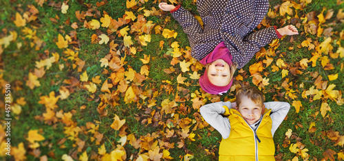 a smiling children enjoys the golden autumn colors photo