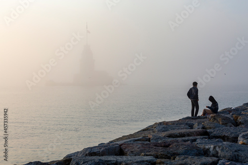 Istanbul, Bosphorus, Uskudar. The old lighthouse of the Ottoman period is in the fog. Maiden tower. (Maiden's Tower) (Maiden's Tower)