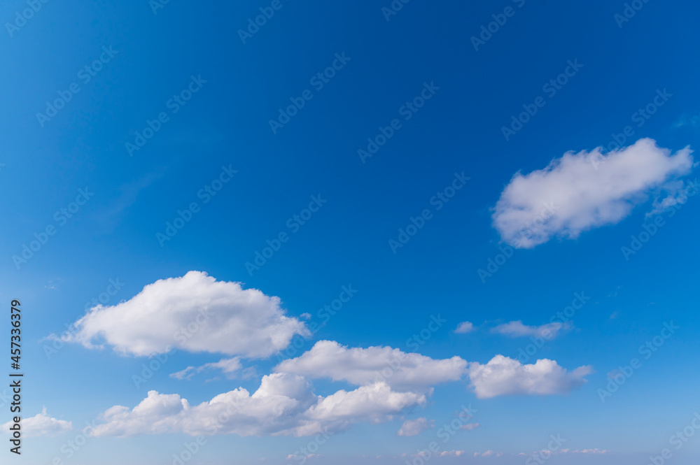 Blue sky and white fluffy tiny clouds background and pattern Blue sky and white fluffy tiny clouds background and pattern