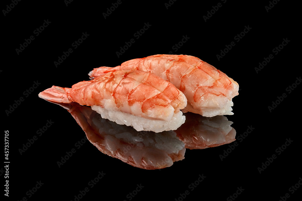 Two shrimp nigiri sushi on black background with reflection Two shrimp nigiri sushi on black background with reflection
