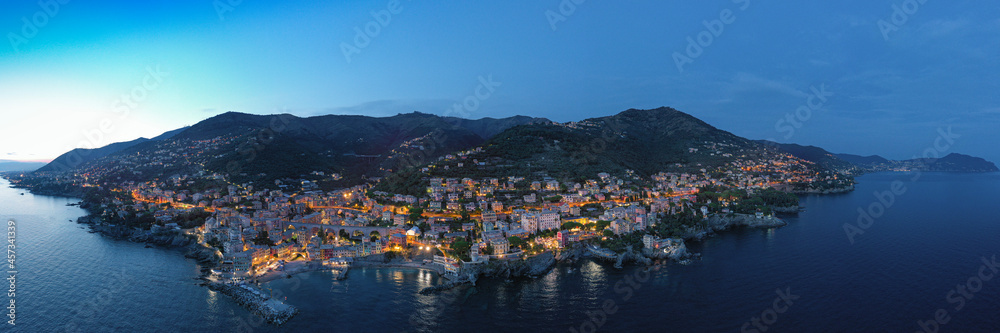  Italy. The towns of  Liguria. Night. City lights.  Italy mediterranean coast. Aerial view.