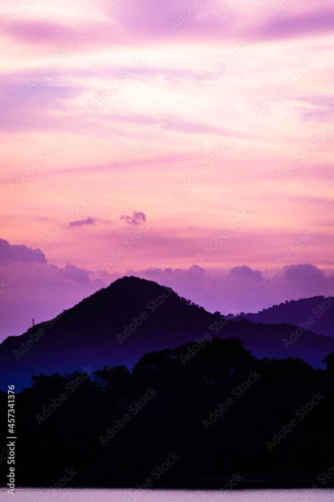 Obraz premium silhouette mountain with attractive background, sunset with vivid purple sky