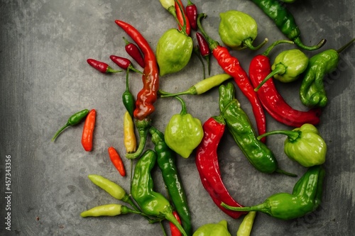 Different types of homegrown chillies or chilli peppers background, selective fo Fototapeta