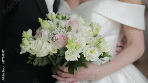 The bride and groom embrace