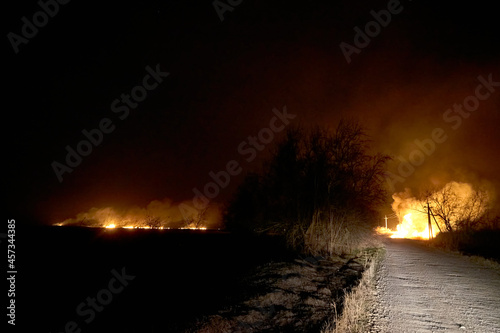 Wildfires. Burning estuary. Fire in the steppe. photo