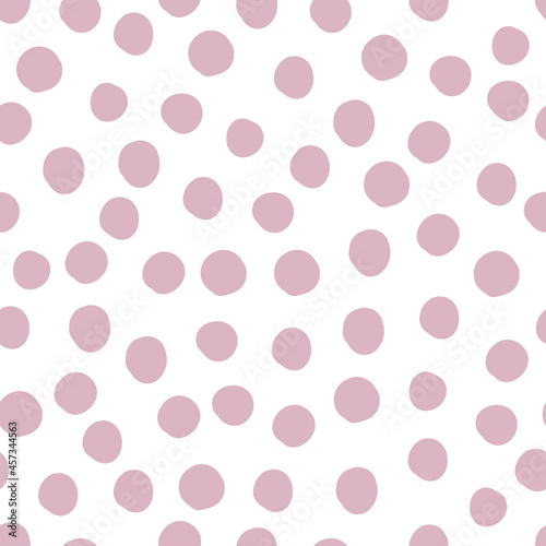 Seamless pattern with pink dots on a white background. Used for wallpaper, paper, fabric and prints.