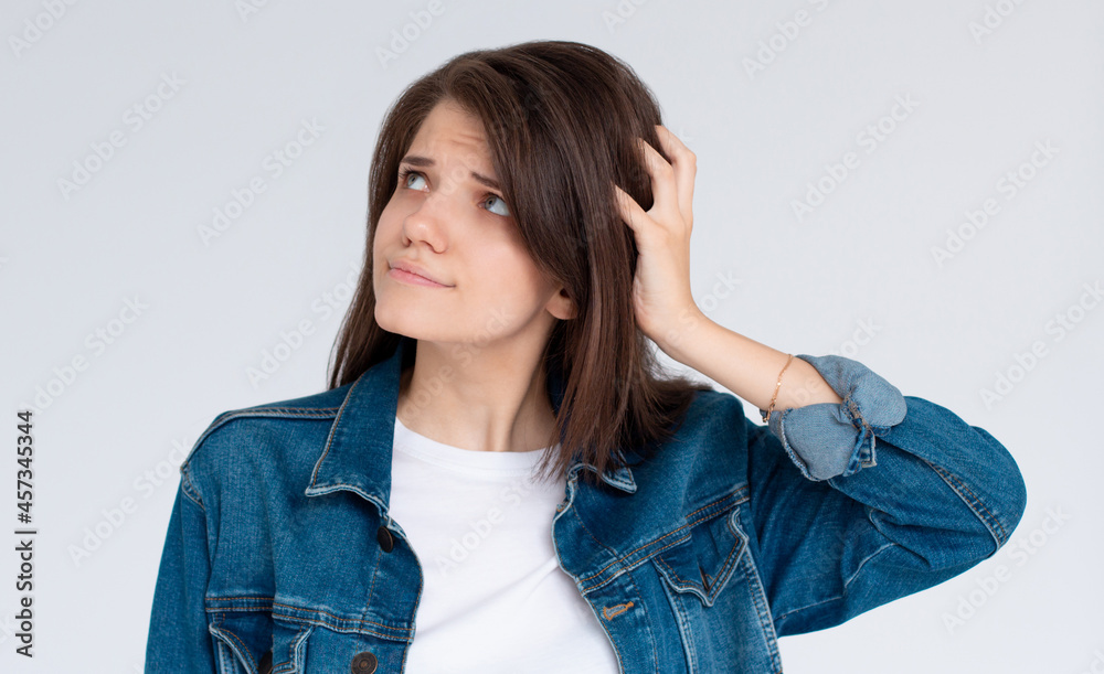 Thoughtful confused and dizzy european woman, Girl face expression feeling worry messy problems on isolated white background. Thoughtful confused and dizzy european woman, Girl face expression feeling worry messy problems on isolated white background.