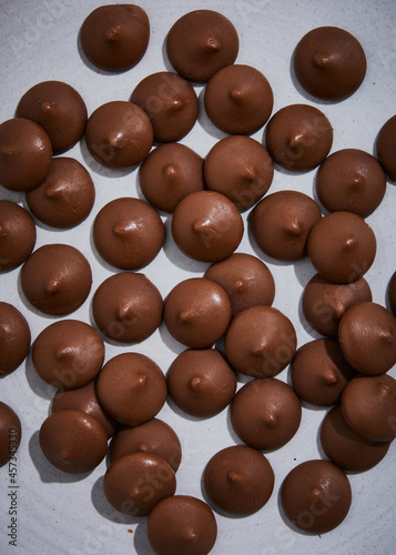 milk chocolate melts buttons close up photo