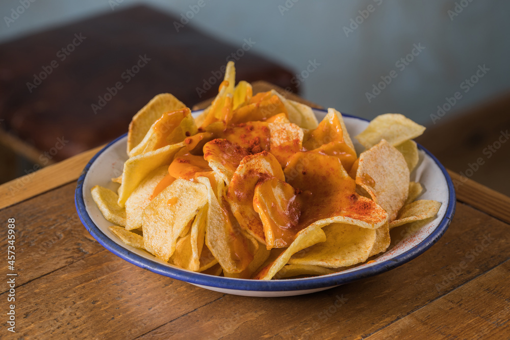 Delicious potato chips in bowl Delicious potato chips in bowl
