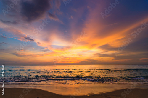 A colorful seascape with a vivid sky background