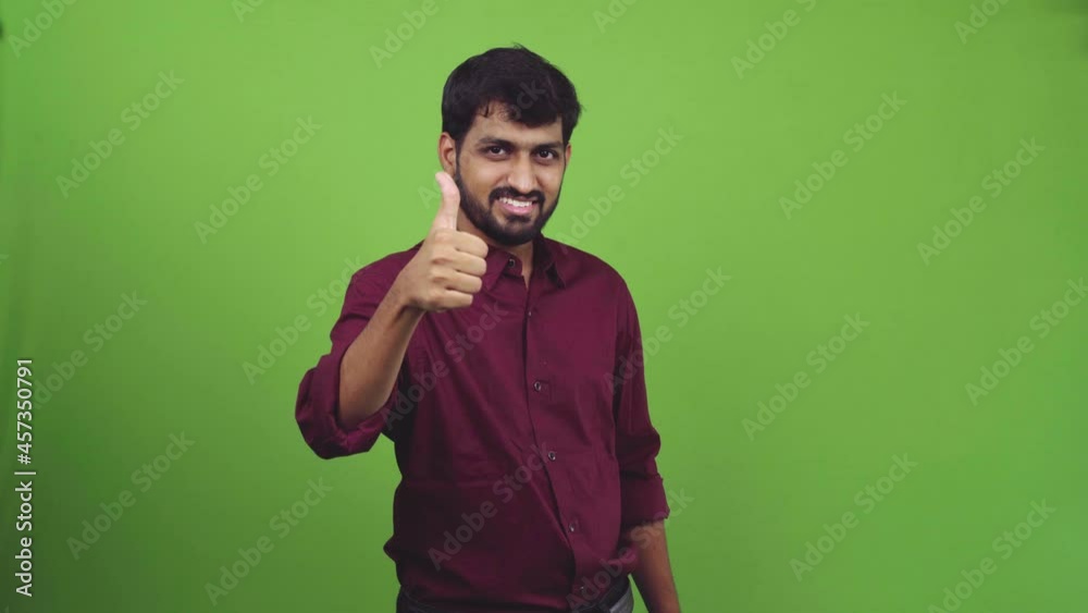 Attractive man rising thumbs up or like, isolated on green screen Attractive man rising thumbs up or like, isolated on green screen