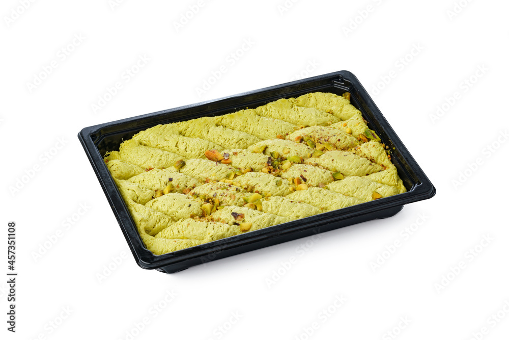 Black plastic box of Turkish halva dessert isolated on white