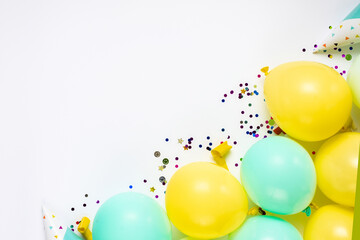Colorful balloons and decoration party on white background top view. Birthday greeting card flat lay