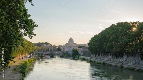 zoom in day to night timelapse by the Tibre river with the classic Vatican City view and Sant'Angelo castle. Famous attraction located within Rome, Italy. cityscape Vaticano, Roma, Italia. photo