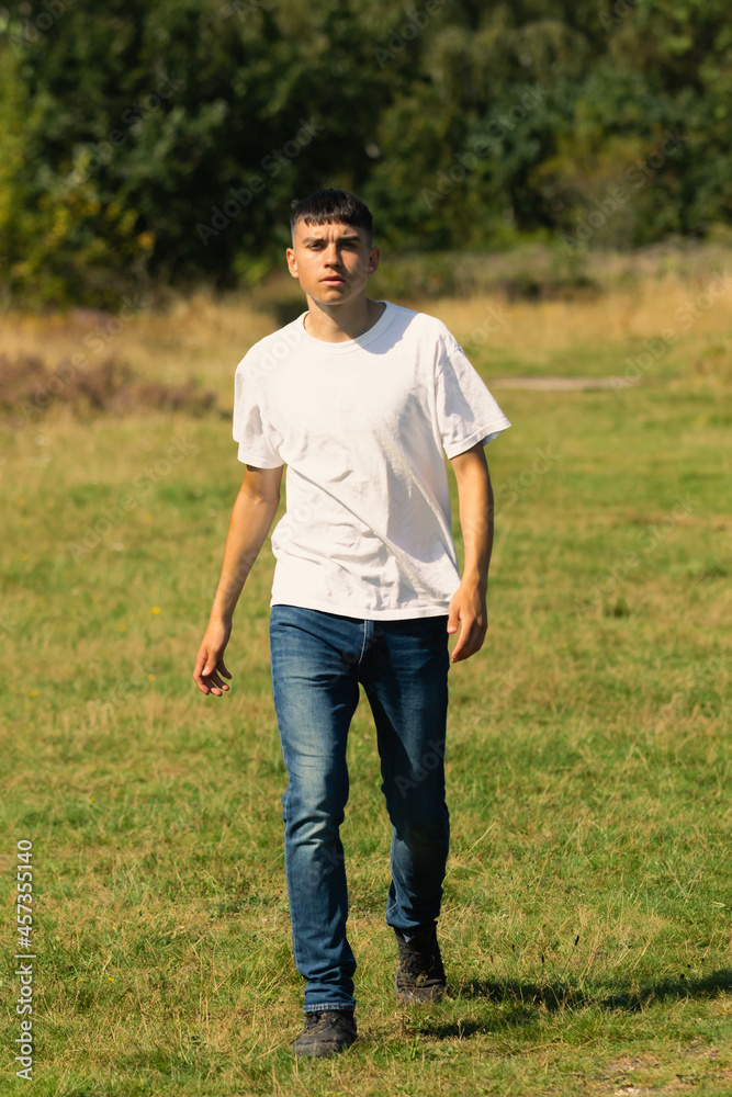 18 year old walking outdoors on a summer day 18 year old walking outdoors on a summer day