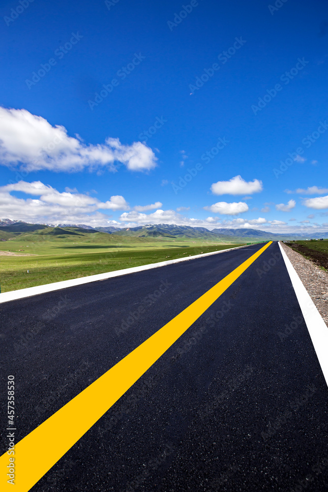 Fototapeta premium Tarmac road under blue sky
