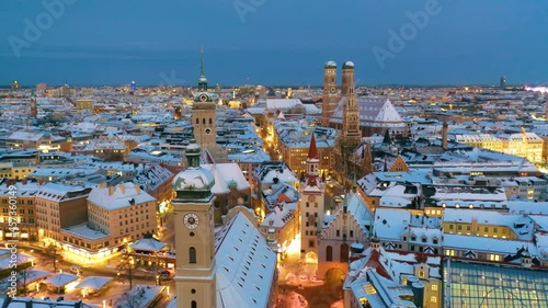 Aerial view of Munich City Germany at winter with snow, Cathedral Church of Our Lady (Frauenkirche) in munich old town Marienplatz. Munchen Skyline aerial view at morning. Munich night winter skyline.