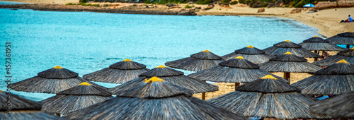 Beach umbrellas at the seaside in summer