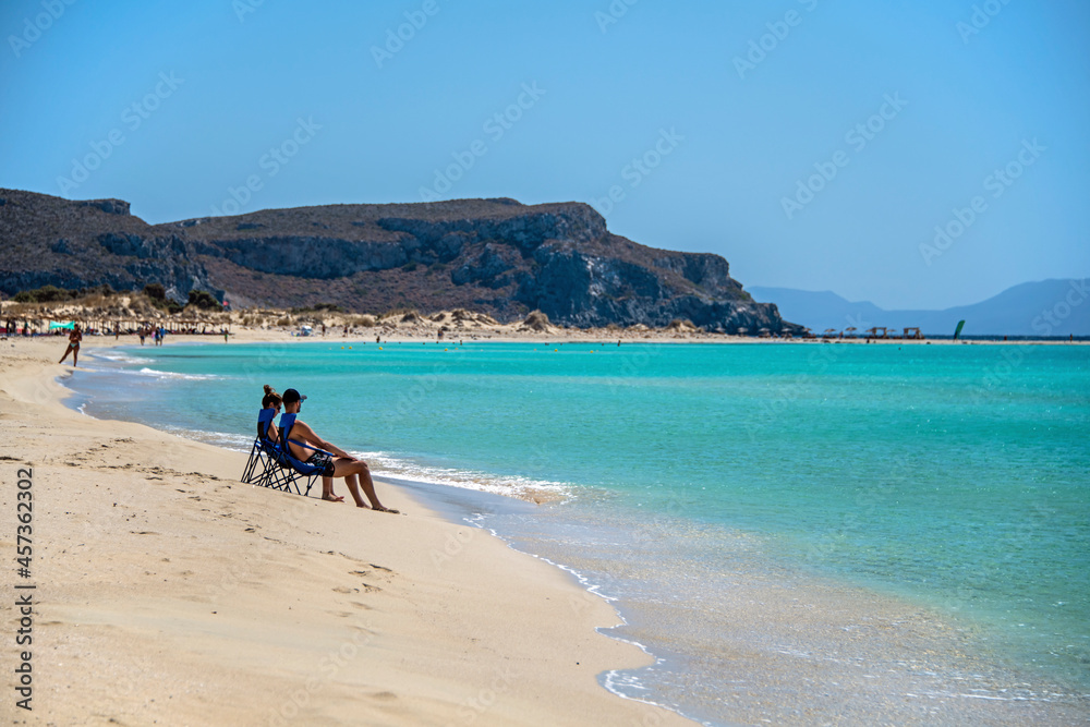 People spend the summer holidays at the seaside People spend the summer holidays at the seaside