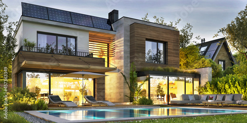 Night view of a beautiful exterior of a modern home with solar panels and a swimming pool