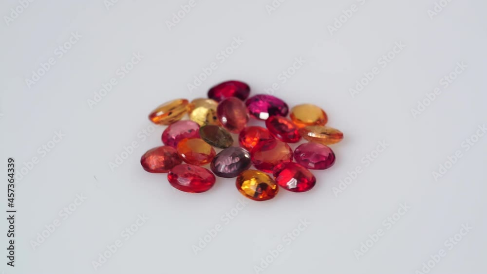 multi color natural sapphire on the white turning table multi color natural sapphire on the white turning table