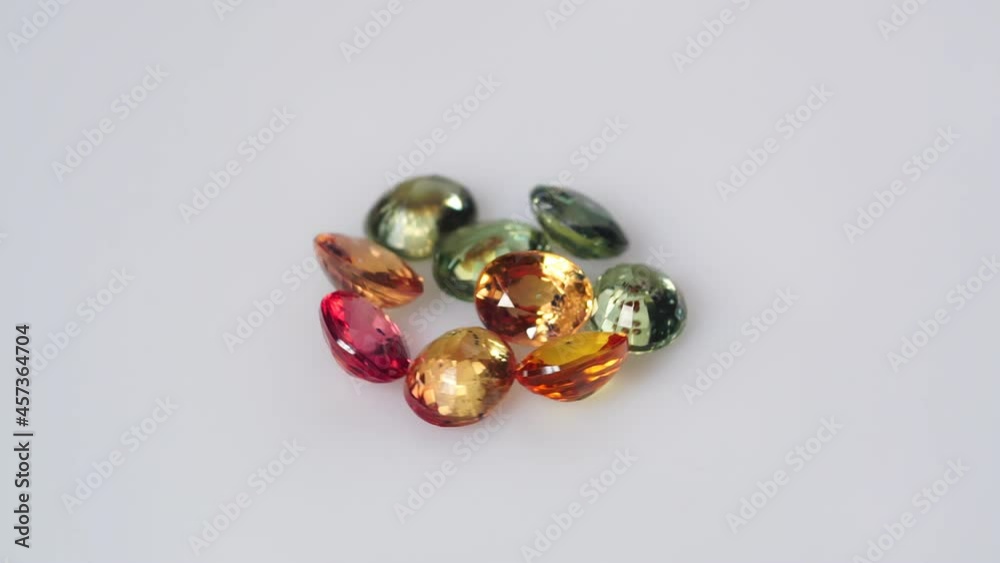 multi color natural sapphire on the white turning table multi color natural sapphire on the white turning table