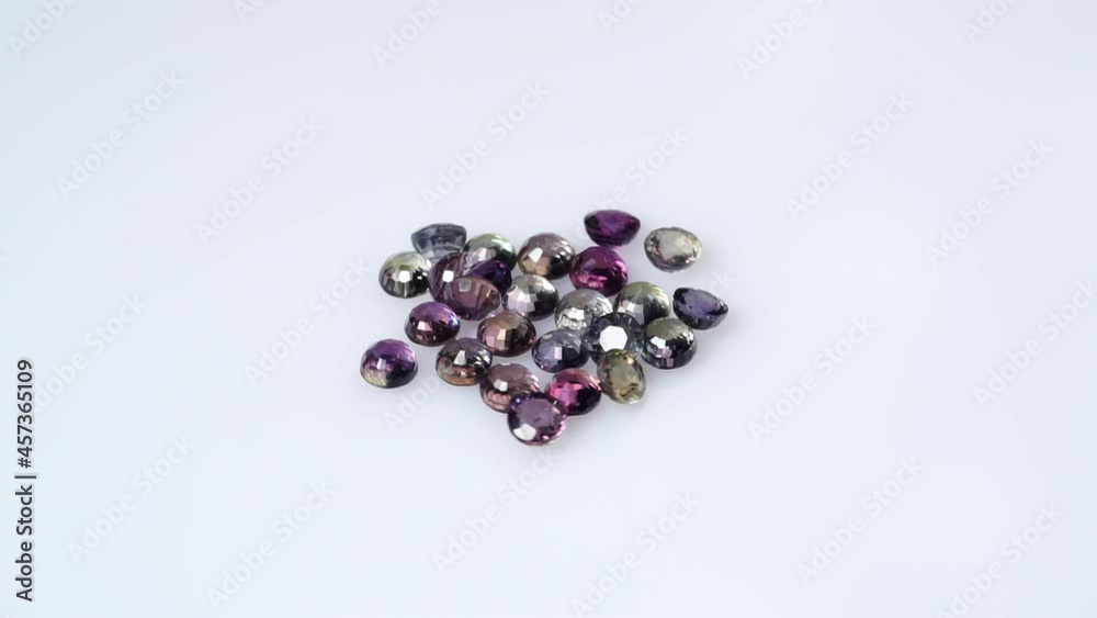 multi color natural sapphire on the white turning table