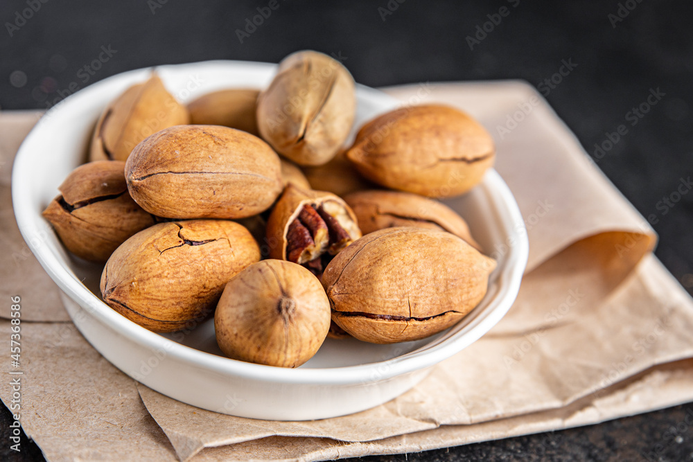pecan nut fresh portion ready to eat meal snack on the table copy space food background rustic. top view keto or paleo diet veggie vegan or vegetarian food pecan nut fresh portion ready to eat meal snack on the table copy space food background rustic. top view keto or paleo diet veggie vegan or vegetarian food