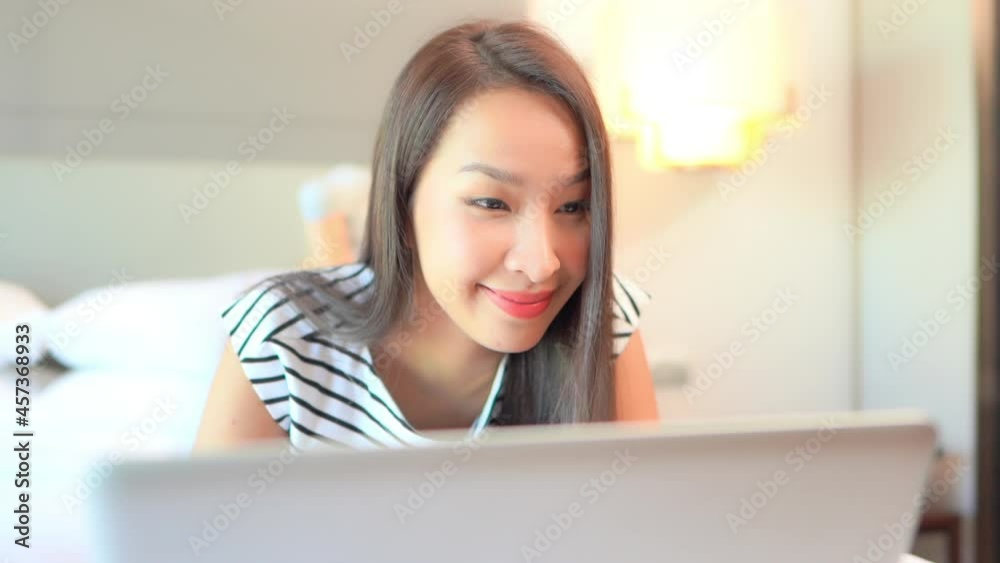 Portrait of Young Happy Asian Woman Working Remotely Online on Laptop With Smile Full Frame Portrait of Young Happy Asian Woman Working Remotely Online on Laptop With Smile Full Frame