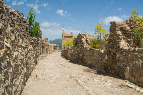 The historic town of Moya on hill during the flowering of  the ferula communis flowers in June 2021   Cuenca Castile La Mancha Spain photo