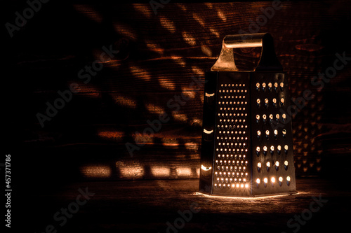 scary kitchen background concept. halloween grater lantern photo