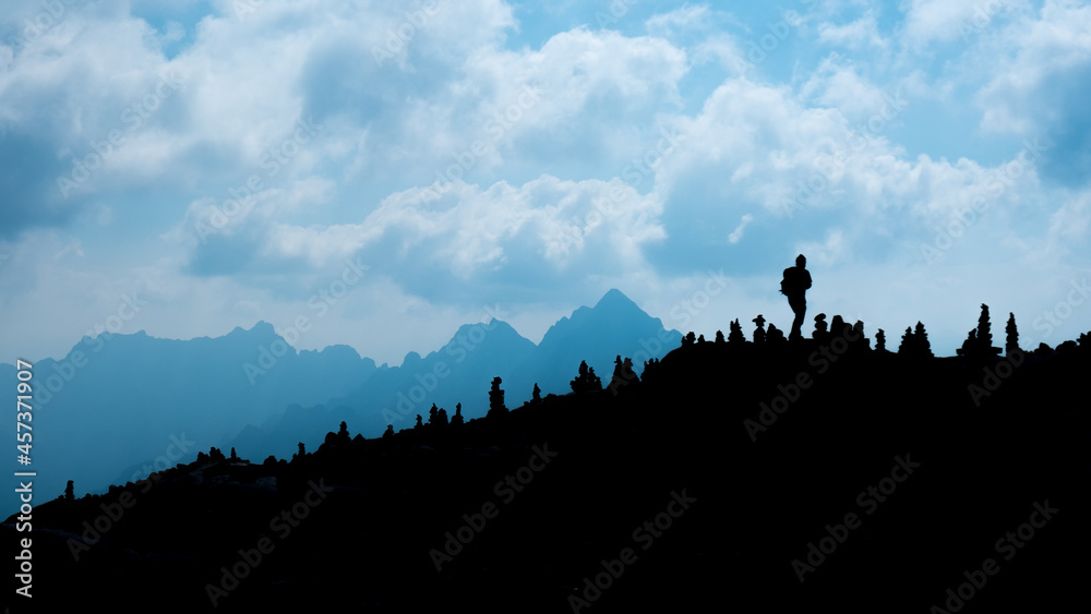 Silhouette of a person in the mountains Silhouette of a person in the mountains