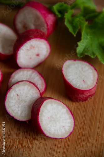 a new crop of radish plant fruits on a wooden table