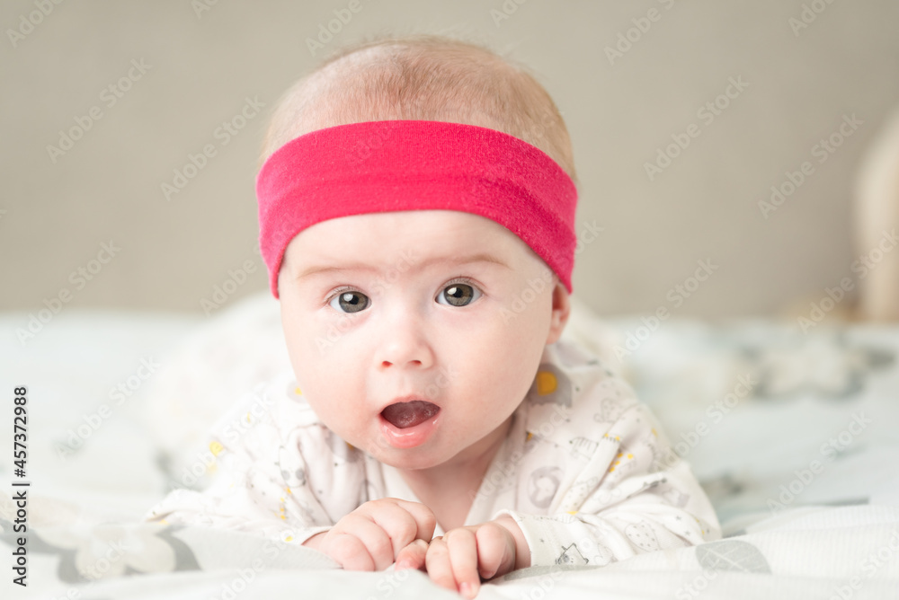 Portrait of a beautiful baby on bright background. New born concept Portrait of a beautiful baby on bright background. New born concept