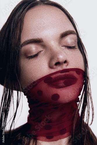 Closeup serious dramatic portrait of girl with dark wine lips makeup, gloomy fits for halloween photo