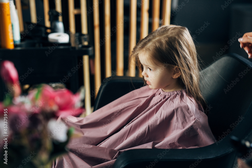 Little girl in the barbershop Little girl in the barbershop